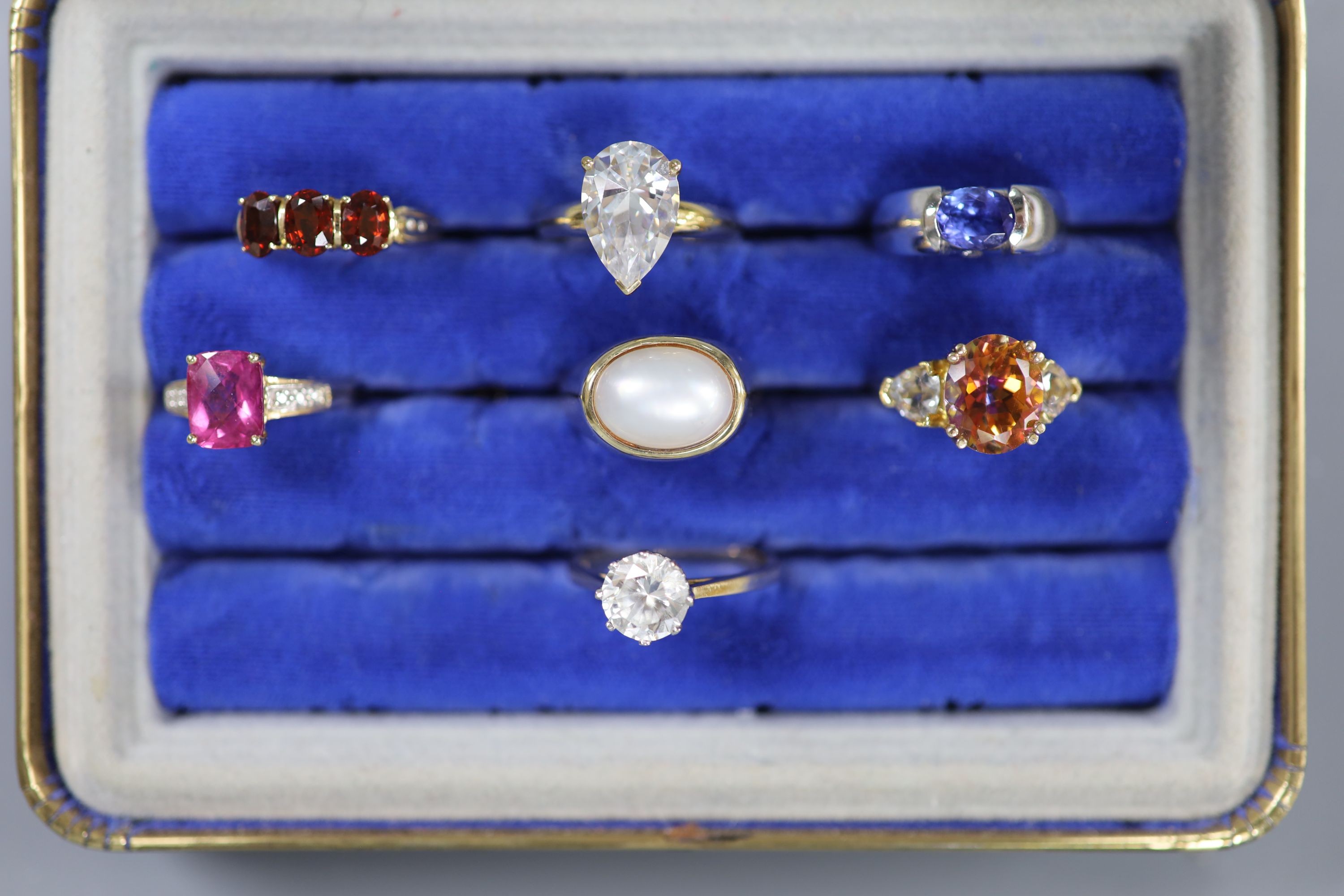 Seven assorted modern 14k and gem set dress rings, gross weight 39.9 grams.